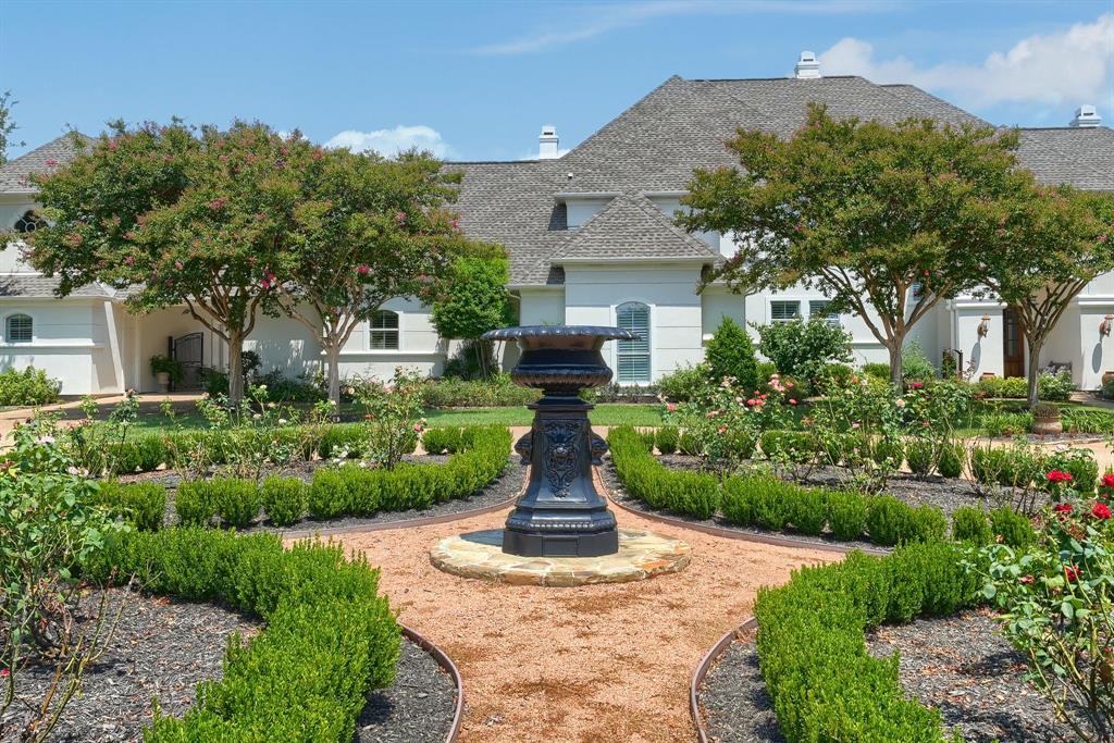 539 Ridge Point Drive Heath, TX 75126 - Photo 5 of 29 a view of a garden with a fountain