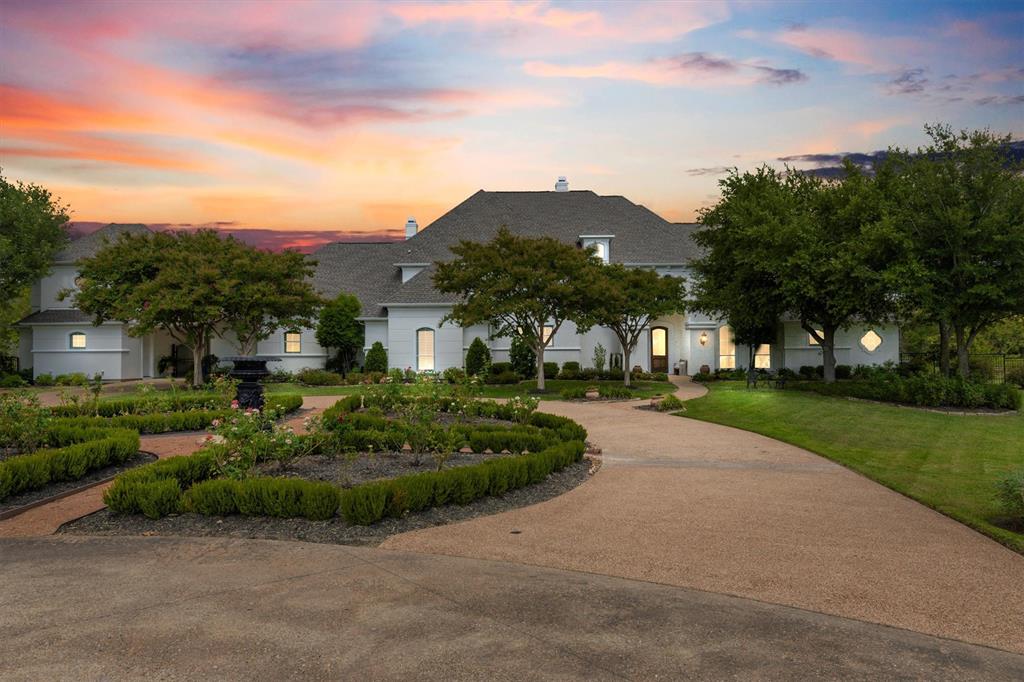 539 Ridge Point Drive Heath, TX 75126 - Photo 6 of 29 a front view of a house with a yard and potted plants