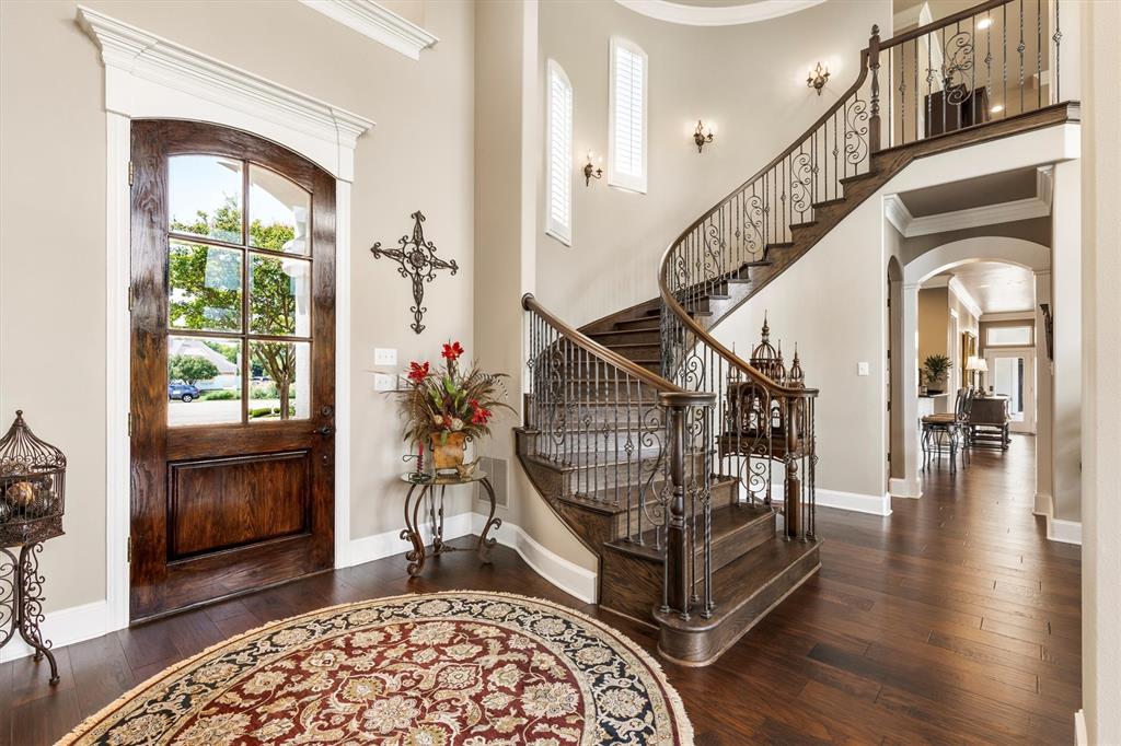 539 Ridge Point Drive Heath, TX 75126 - Photo 9 of 29 a view of entryway with wooden floor and a livingroom