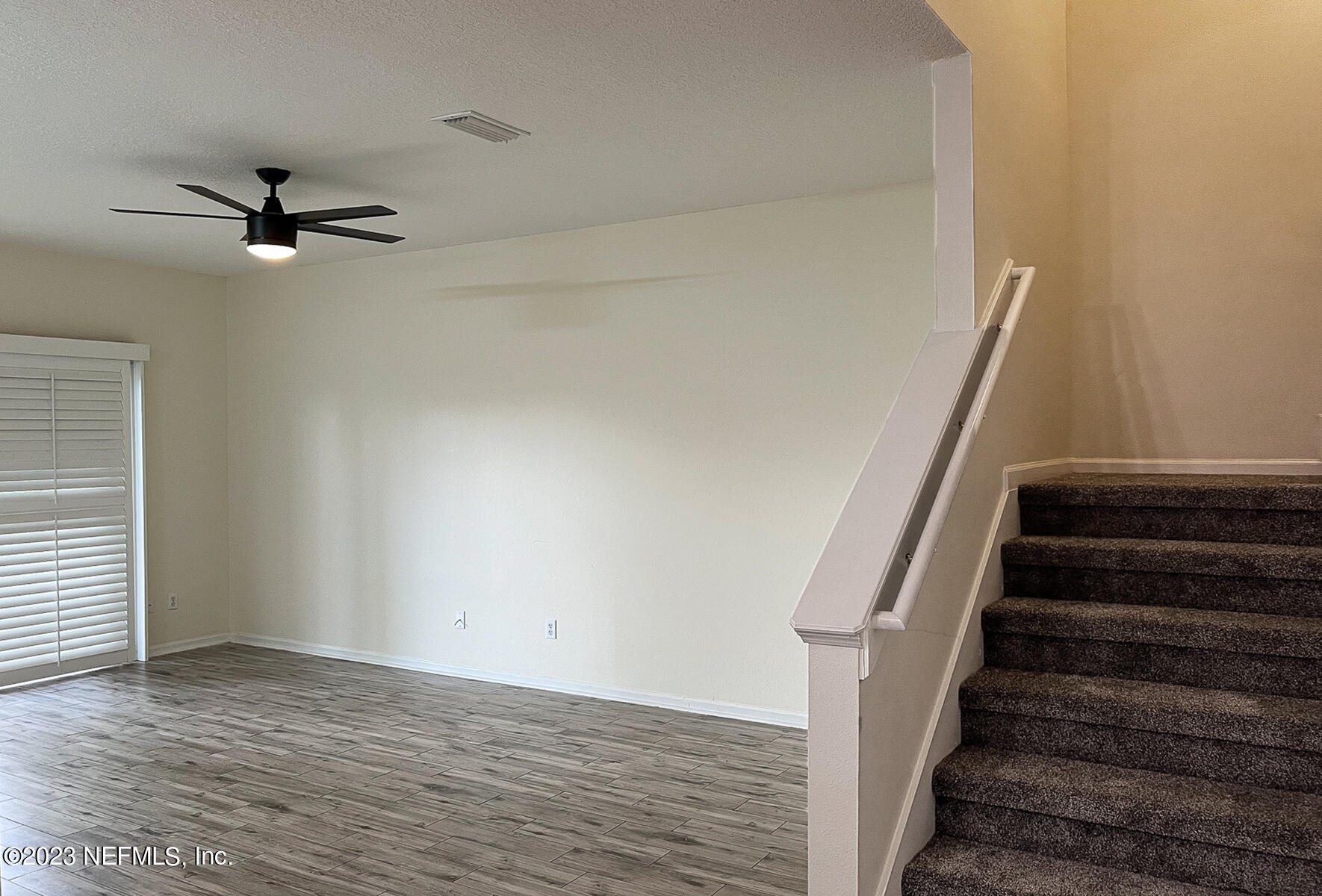 5260 Collins Road, Unit 603 Jacksonville, FL 32244 - Photo 7 of 23 a view of an empty room with stairs