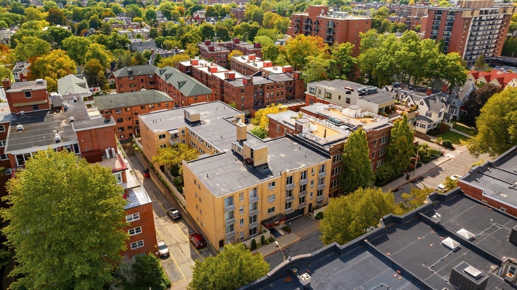 123 Sewall Avenue, Unit LC Brookline, MA 02446 - Photo 23 of 32 an aerial view of a house with a yard