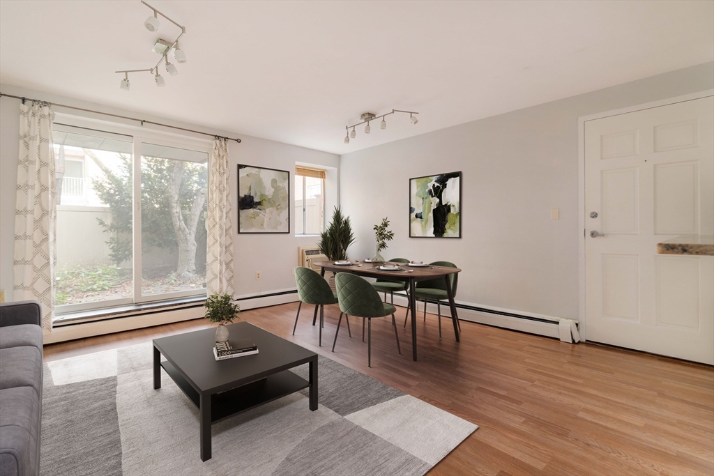 123 Sewall Avenue, Unit LC Brookline, MA 02446 - Photo 3 of 32 a living room with furniture and a window