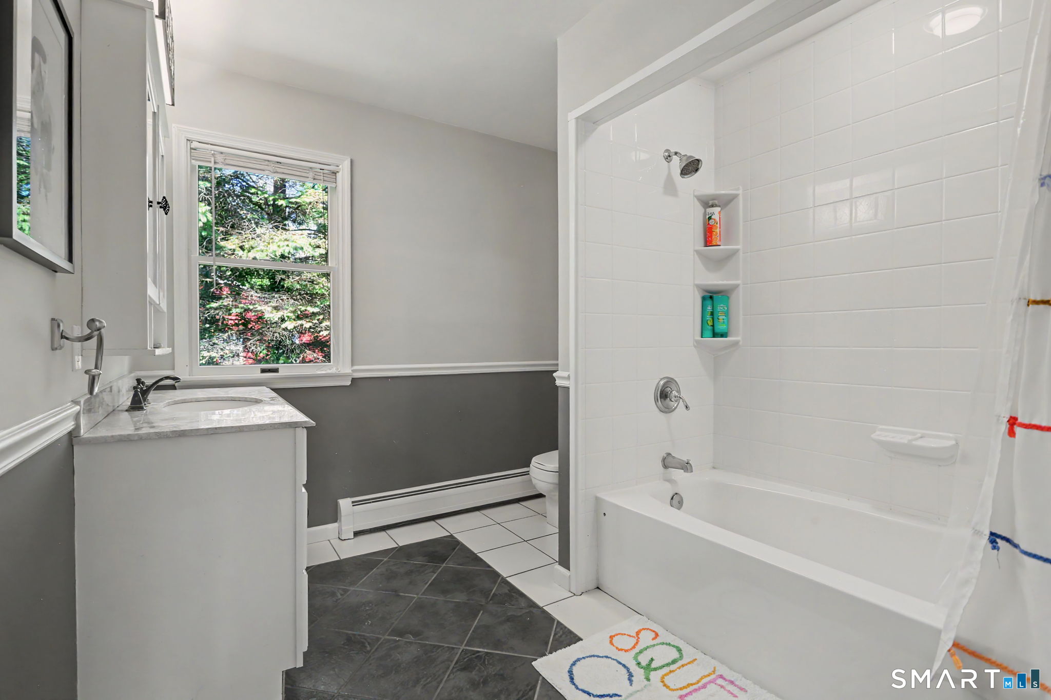 2 Rising Road Norwalk, CT 06850 - Photo 21 of 33 a bathroom with a granite countertop sink and a bathtub