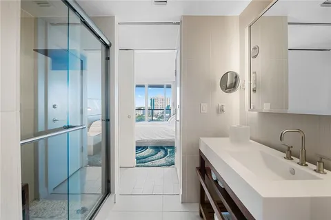 a en suite bathroom with a sink and mirror