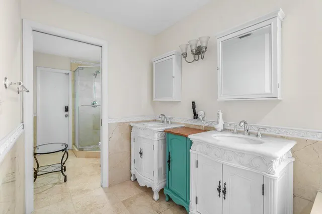 a spacious bathroom with a granite countertop sink a mirror and a