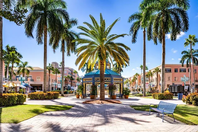 a view of a palm trees in front of a building
