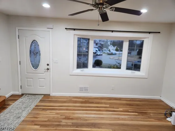 a view of a livingroom with wooden floor