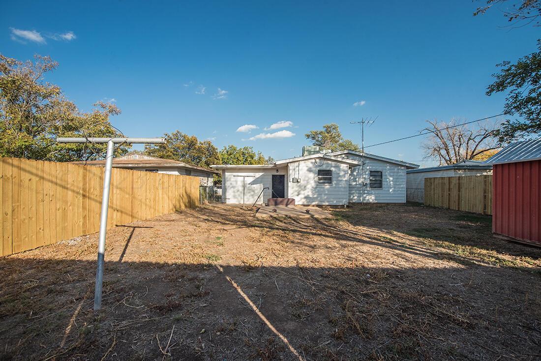 4008 Gables Street Amarillo, TX 79110 - Photo 14 of 15 a view of a dirt road with a building in the background