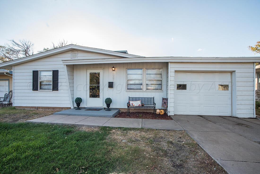 4008 Gables Street Amarillo, TX 79110 - Photo 15 of 15 a view of a house with backyard and chairs