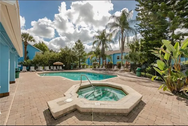 a view of a swimming pool with a patio