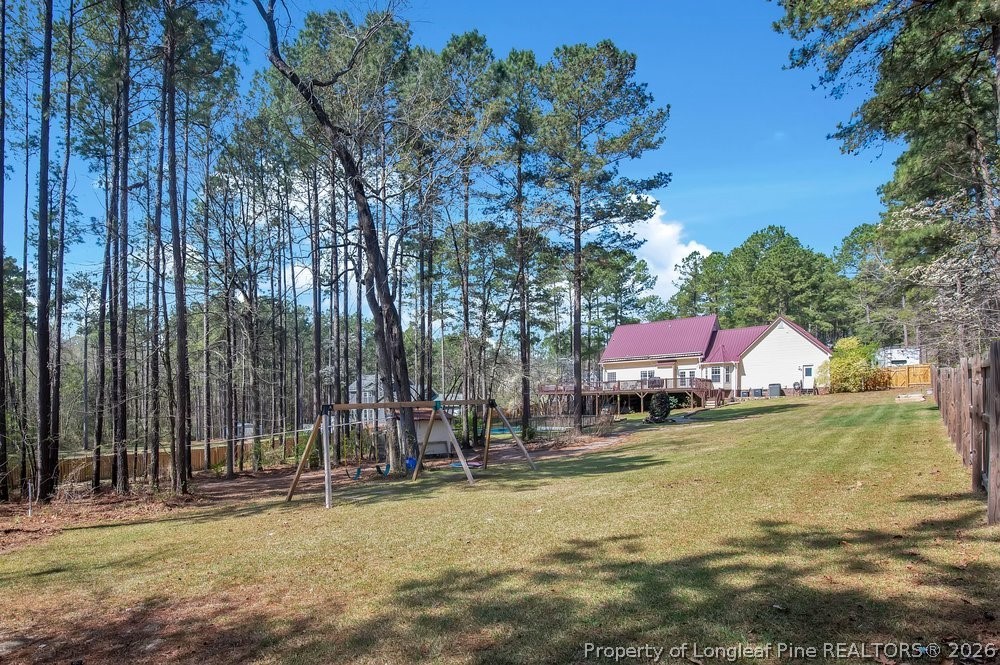 419 Senter Lane Bunnlevel, NC 28323 - Photo 43 of 49 a swimming pool with outdoor seating and yard