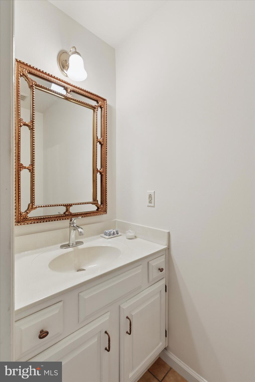12 Wingstone Lane Devon, PA 19333 - Photo 13 of 31 a bathroom with a sink vanity and a mirror
