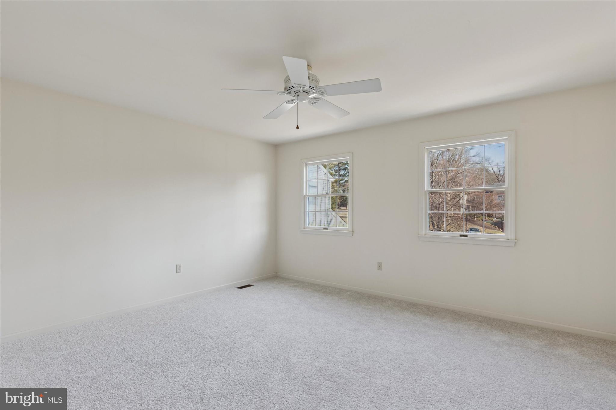 12 Wingstone Lane Devon, PA 19333 - Photo 27 of 31 an empty room with windows and ceiling fan
