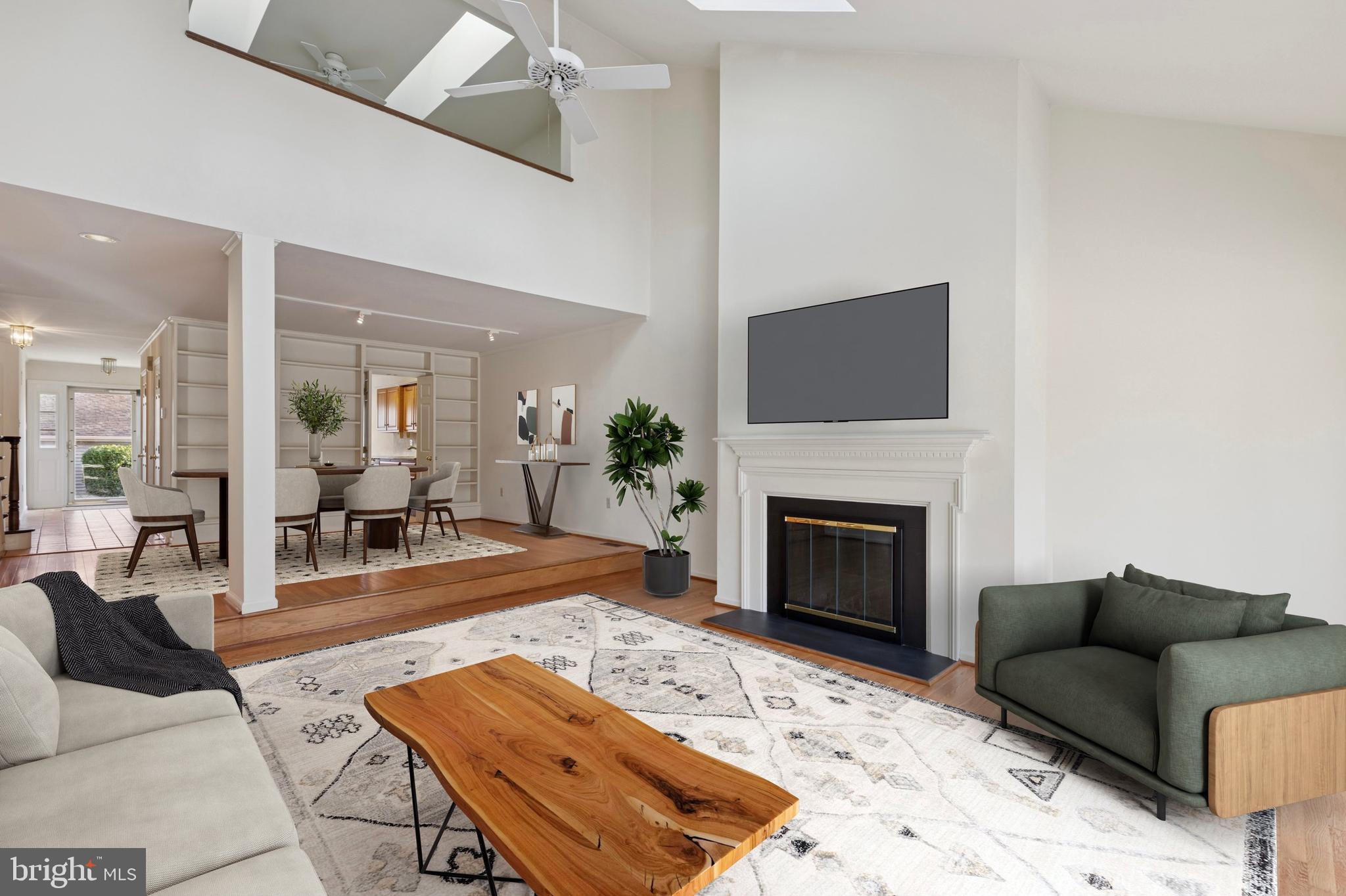12 Wingstone Lane Devon, PA 19333 - Photo 6 of 31 a living room with furniture a fireplace and a flat screen tv