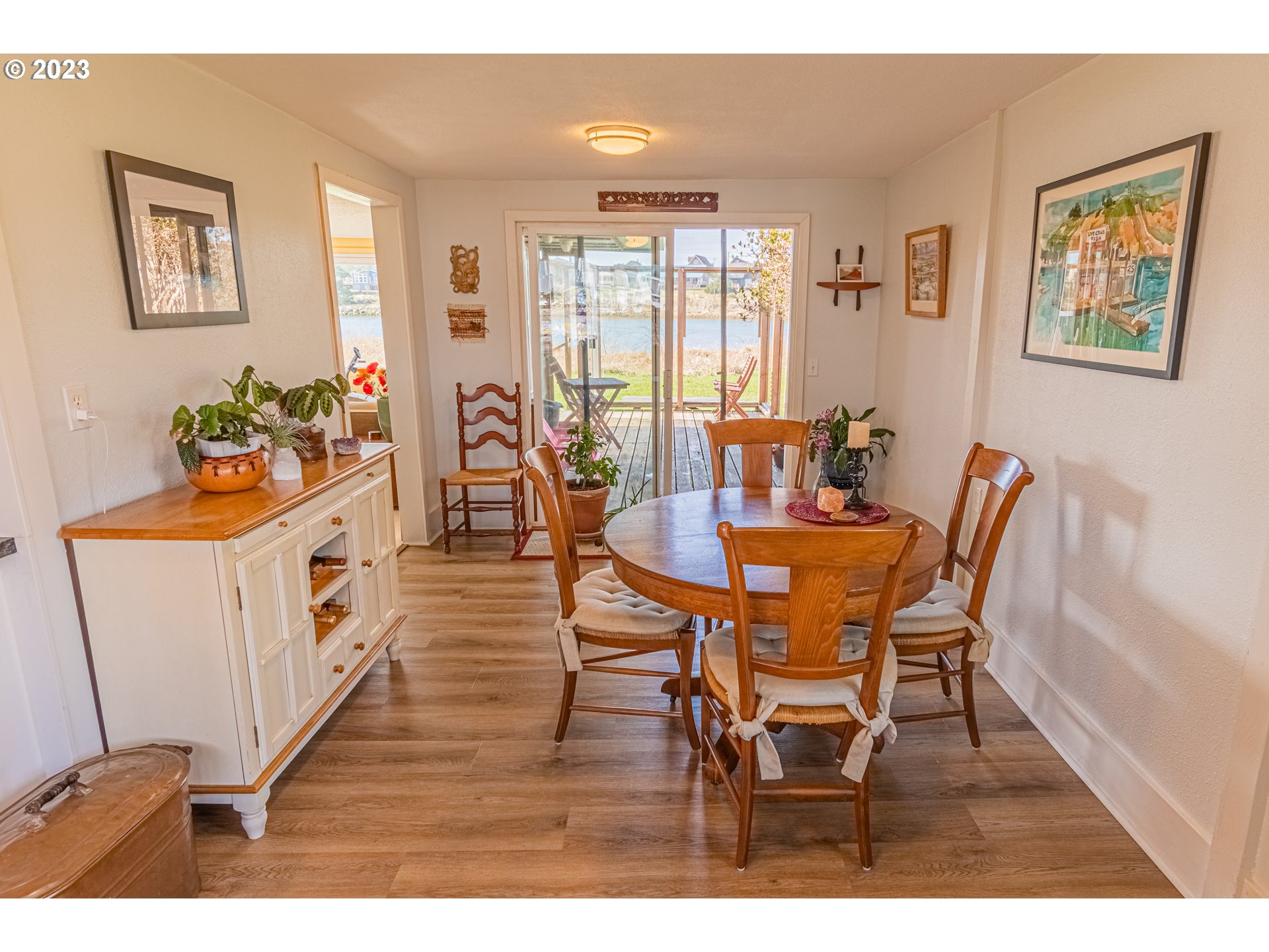 35160 Rueppel Avenue Pacific City, OR 97135 - Photo 12 of 26 a view of a dining room with furniture window and wooden floor