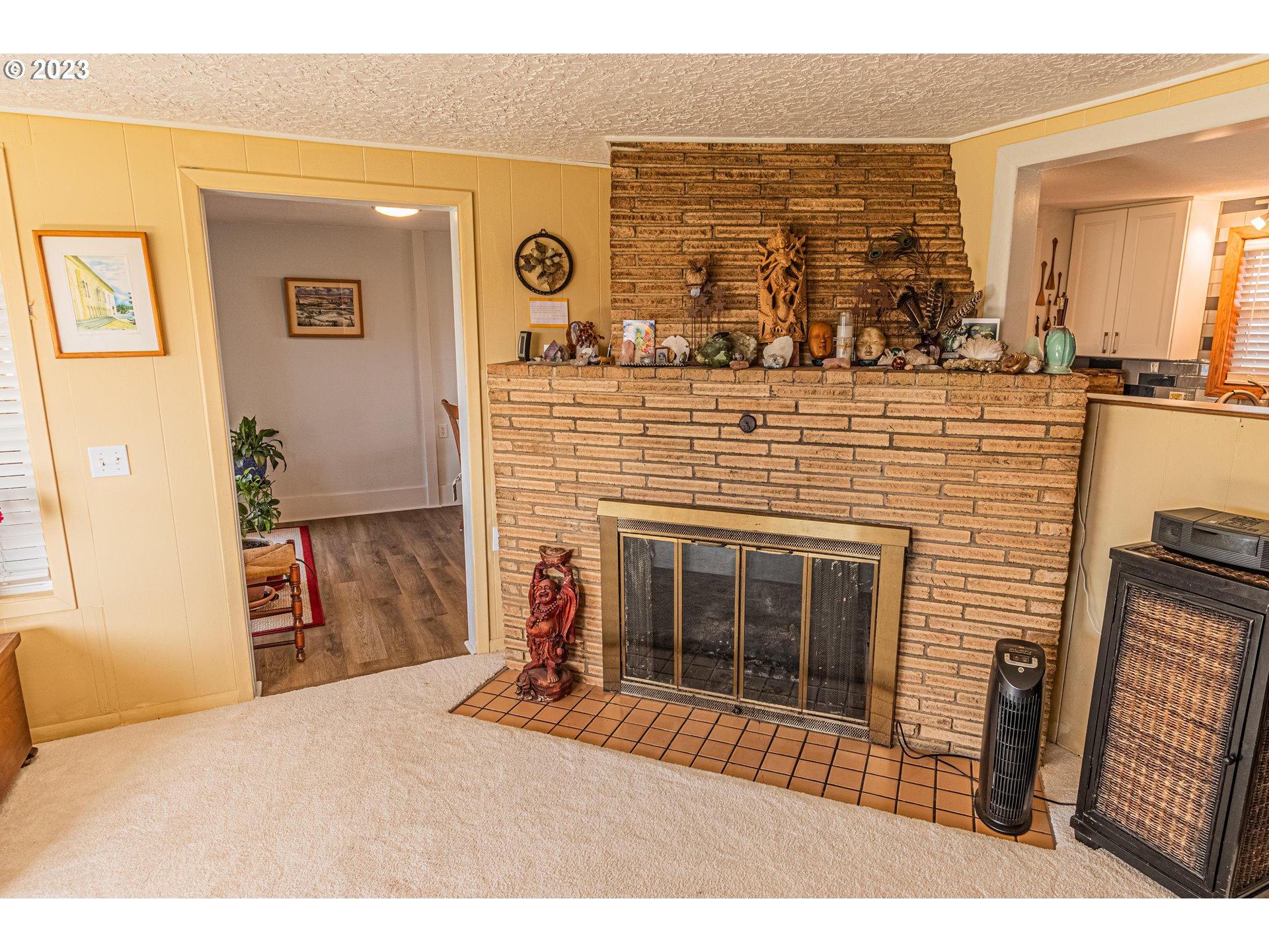 35160 Rueppel Avenue Pacific City, OR 97135 - Photo 14 of 26 a bedroom with a bed and a fireplace