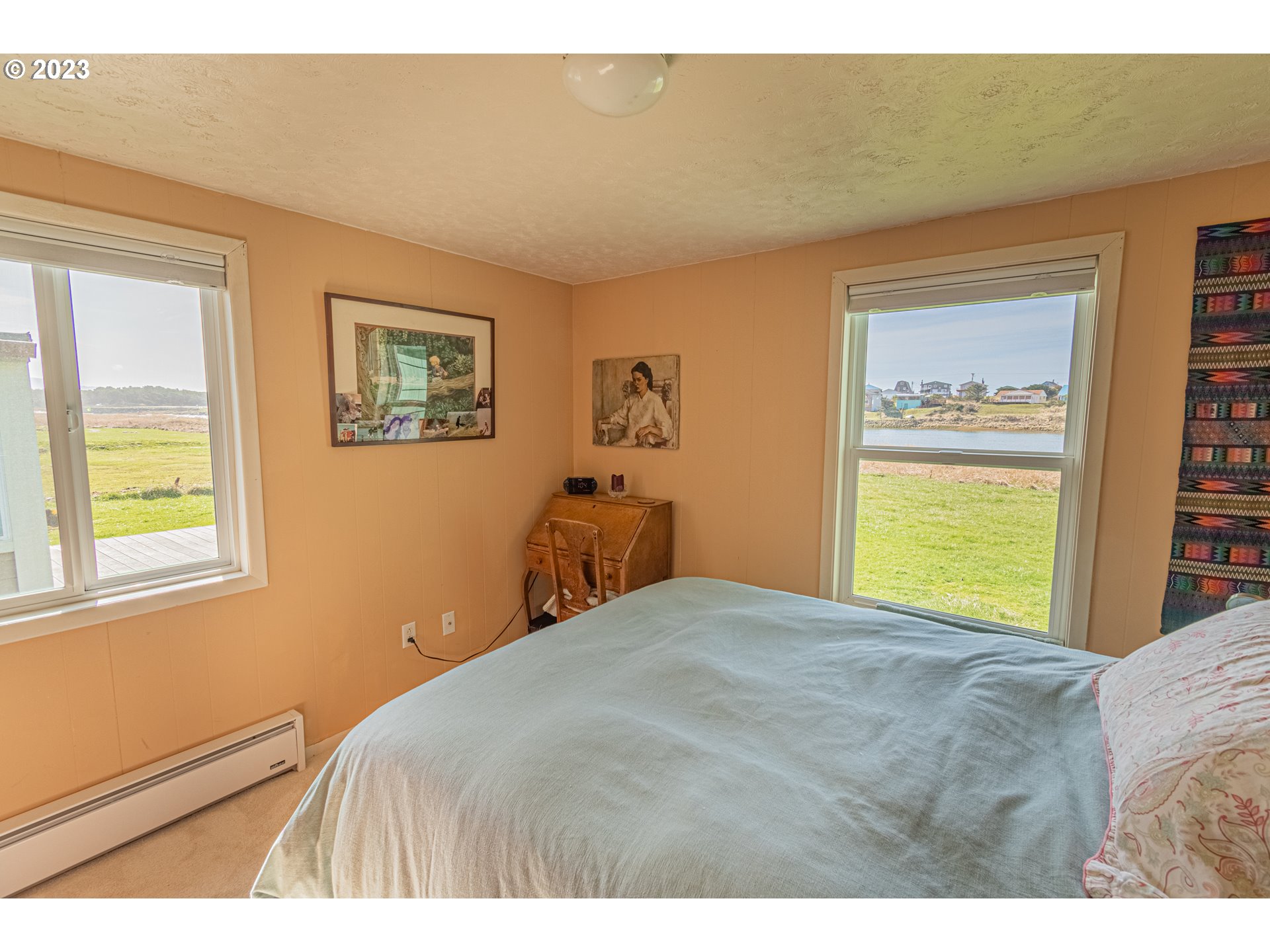 35160 Rueppel Avenue Pacific City, OR 97135 - Photo 18 of 26 a bedroom with a bed and a window