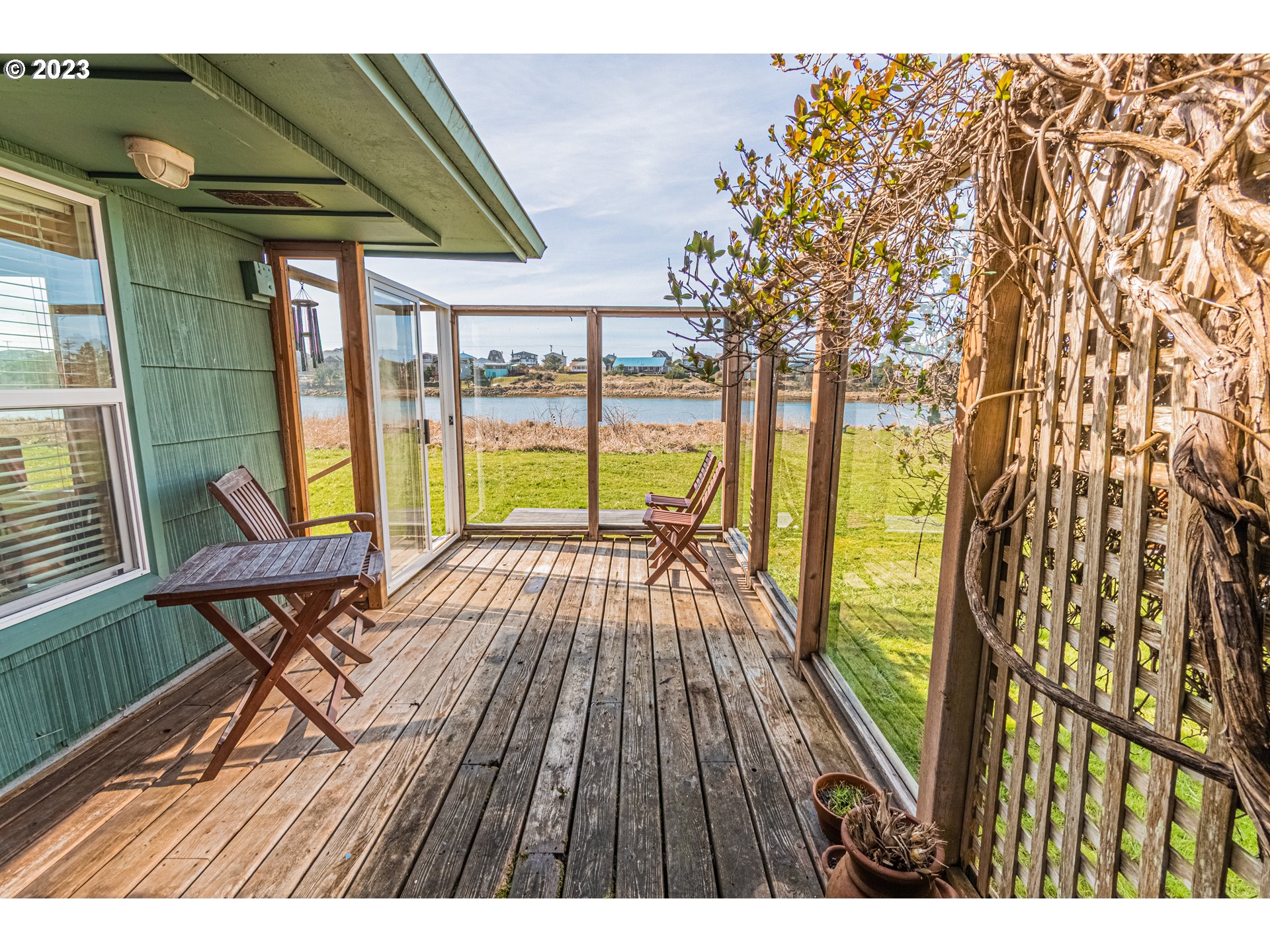 35160 Rueppel Avenue Pacific City, OR 97135 - Photo 21 of 26 a view of balcony with wooden floor and outdoor seating