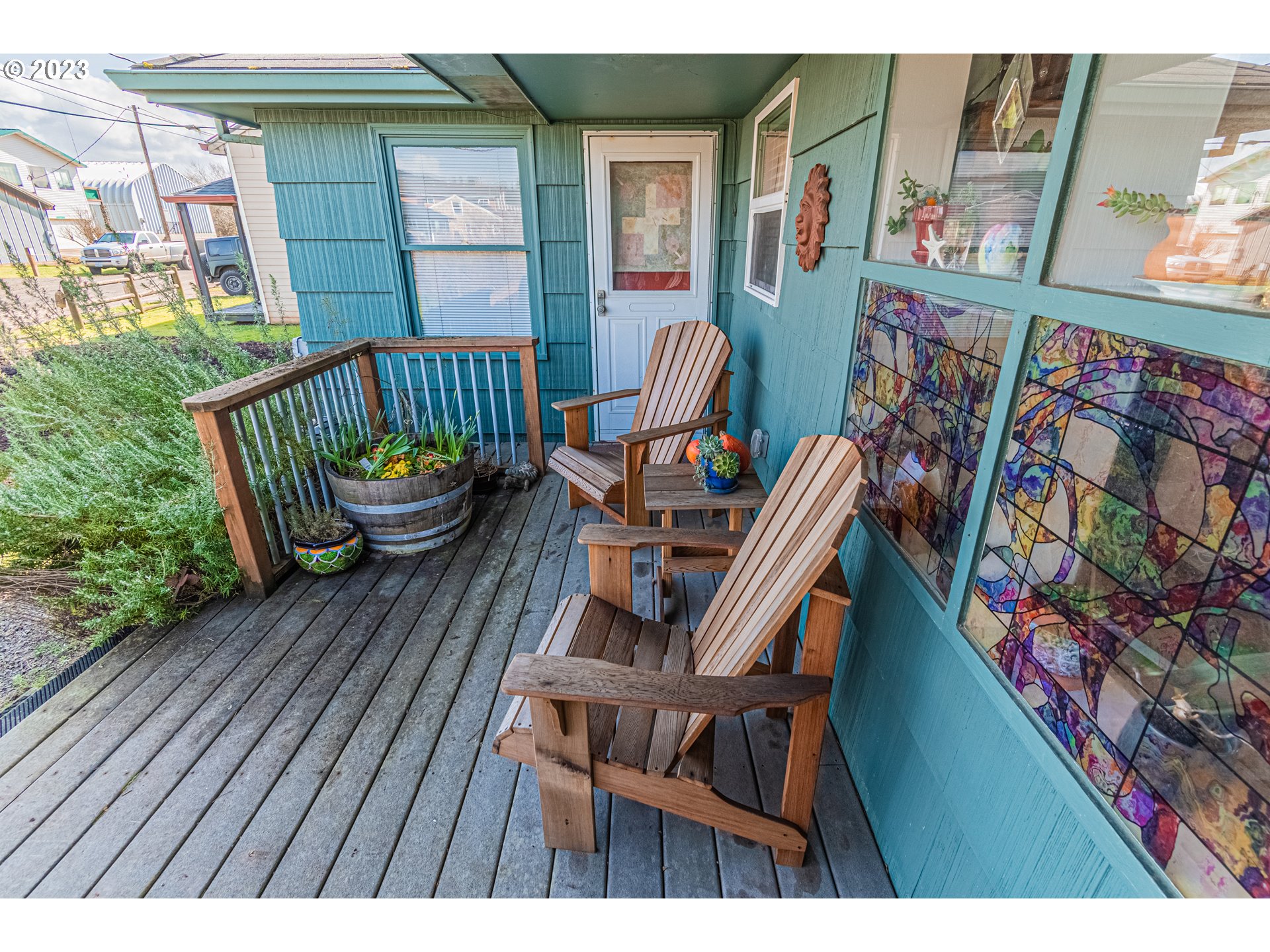 35160 Rueppel Avenue Pacific City, OR 97135 - Photo 23 of 26 a balcony with wooden floor and furniture