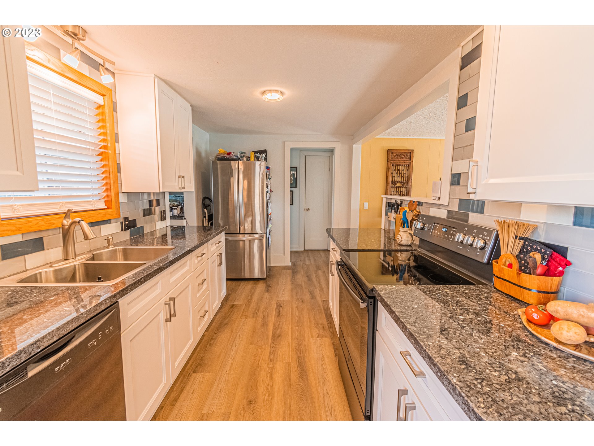 35160 Rueppel Avenue Pacific City, OR 97135 - Photo 5 of 26 a kitchen with granite countertop lots of counter top space and stainless steel appliances