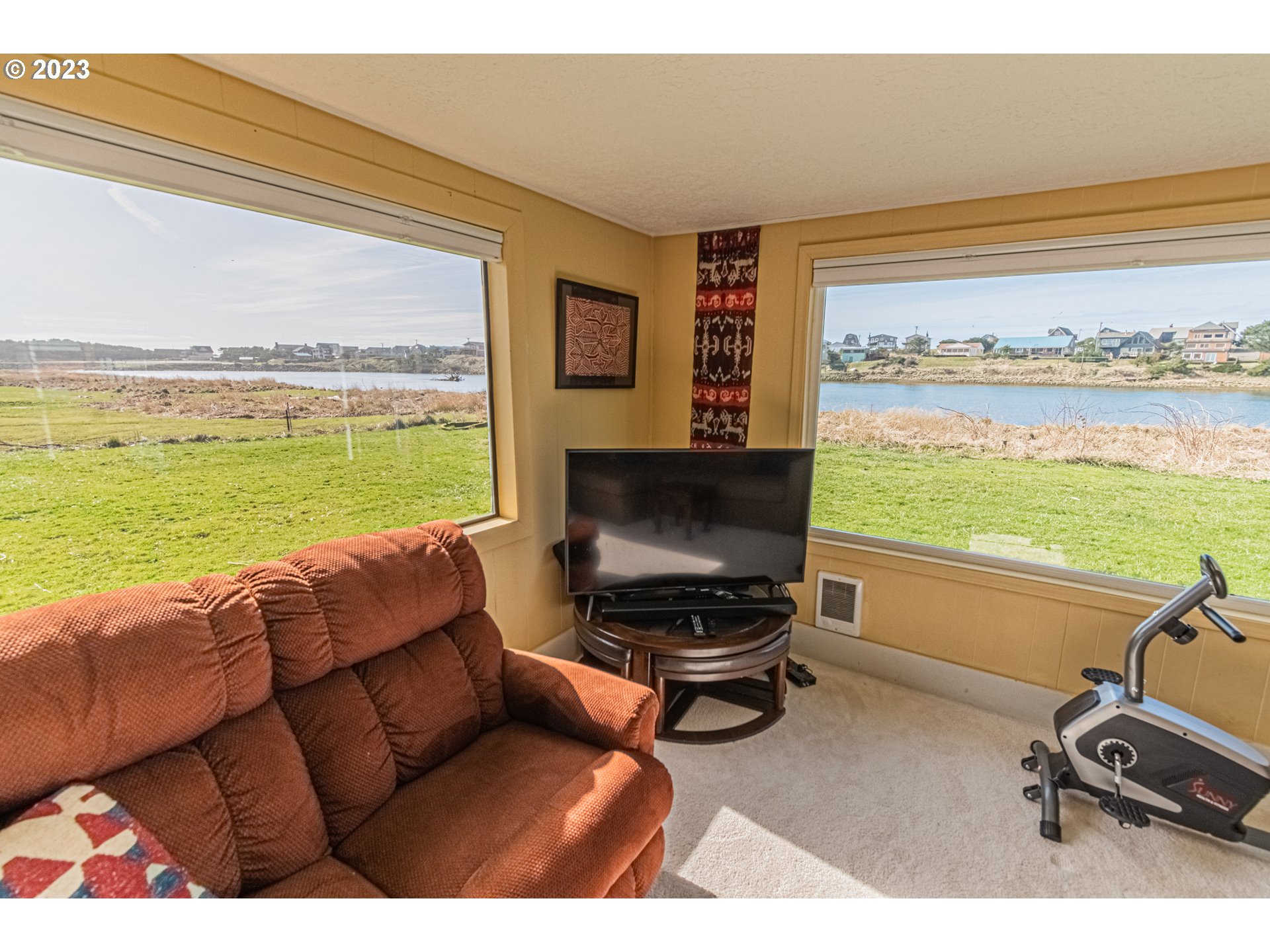35160 Rueppel Avenue Pacific City, OR 97135 - Photo 9 of 26 a living room with furniture and a flat screen tv