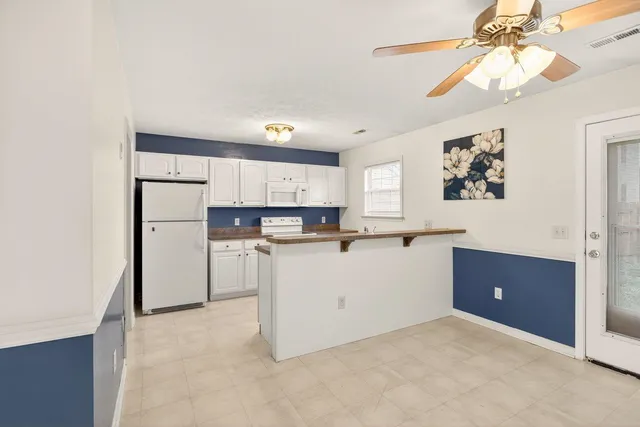 a room with cabinets and a window