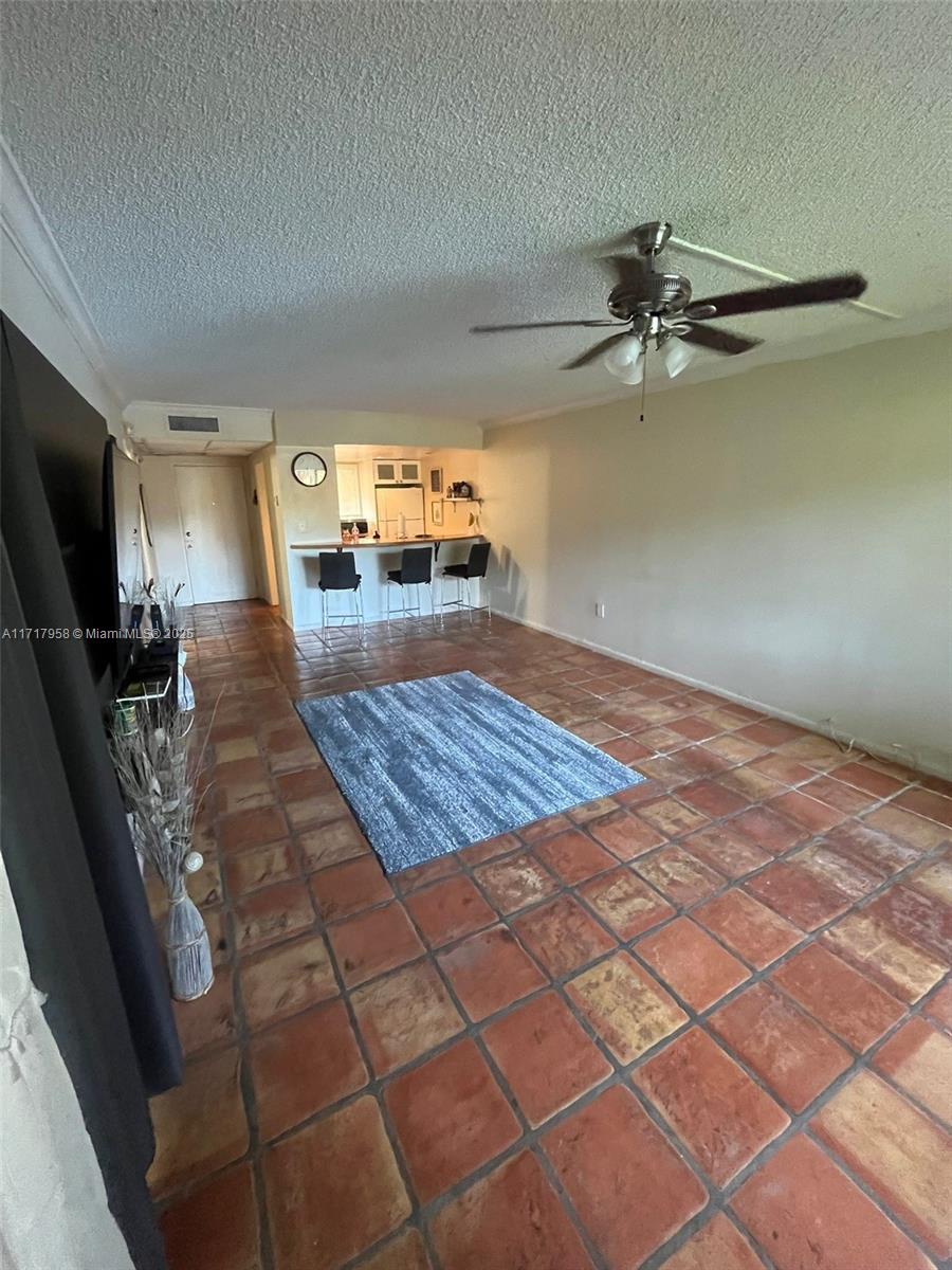 812 Southwest 9th St Circle, Unit 101 Boca Raton, FL 33486 - Photo 6 of 17 a living room with a couch