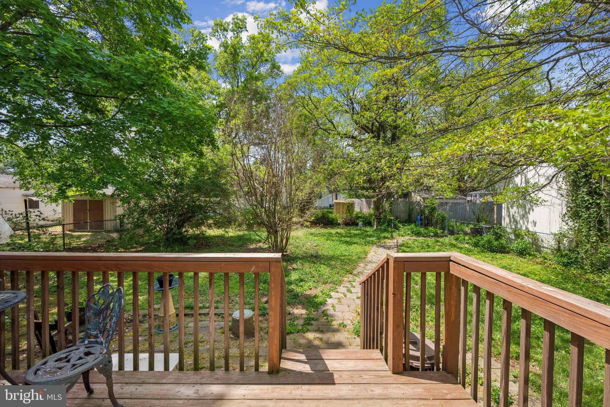 21 Devlin Avenue Burlington, NJ 08016 - Photo 17 of 20 a view of a wooden deck next to a yard