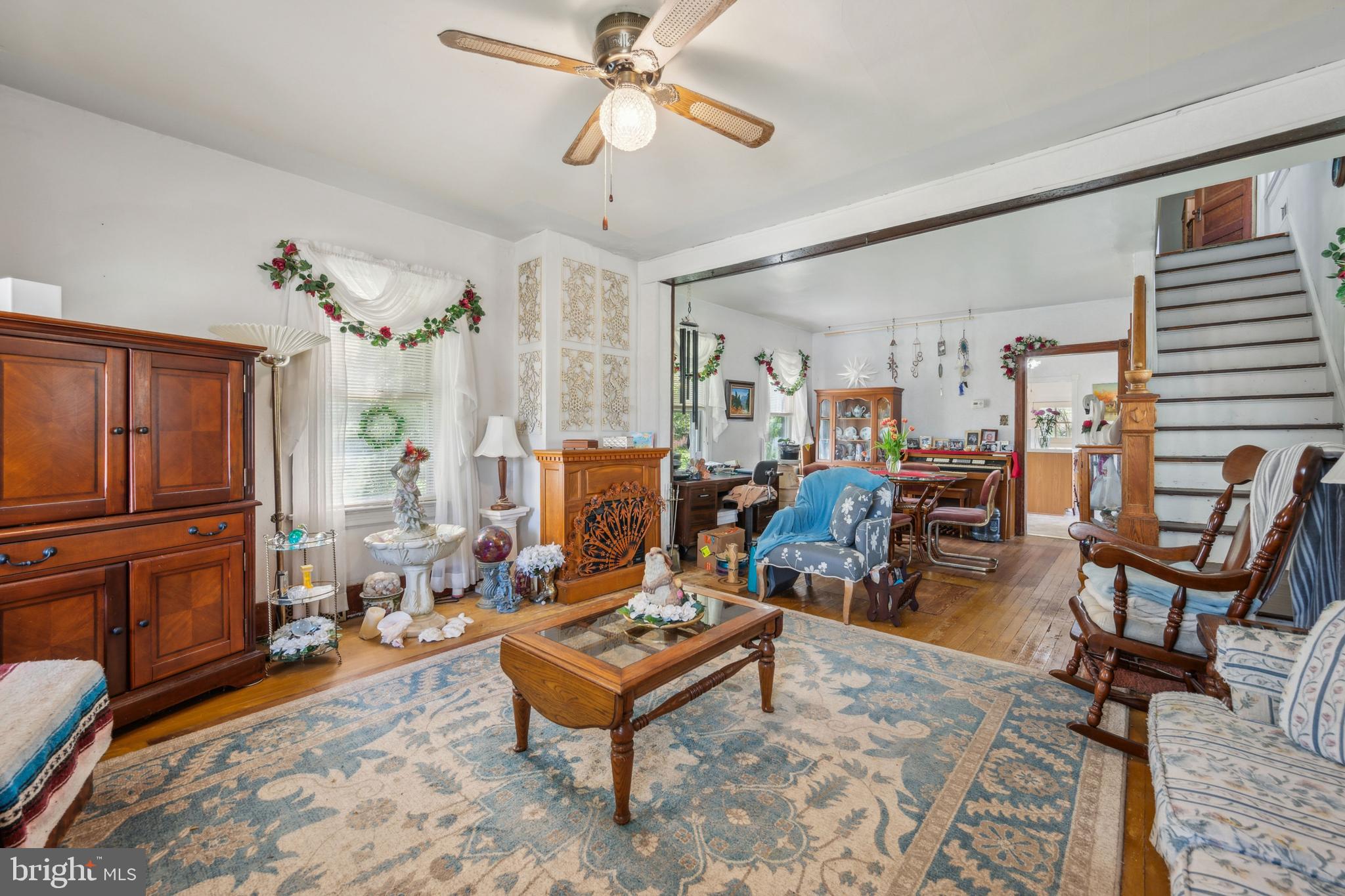 21 Devlin Avenue Burlington, NJ 08016 - Photo 5 of 20 a living room with furniture a dining table and chairs with wooden floor