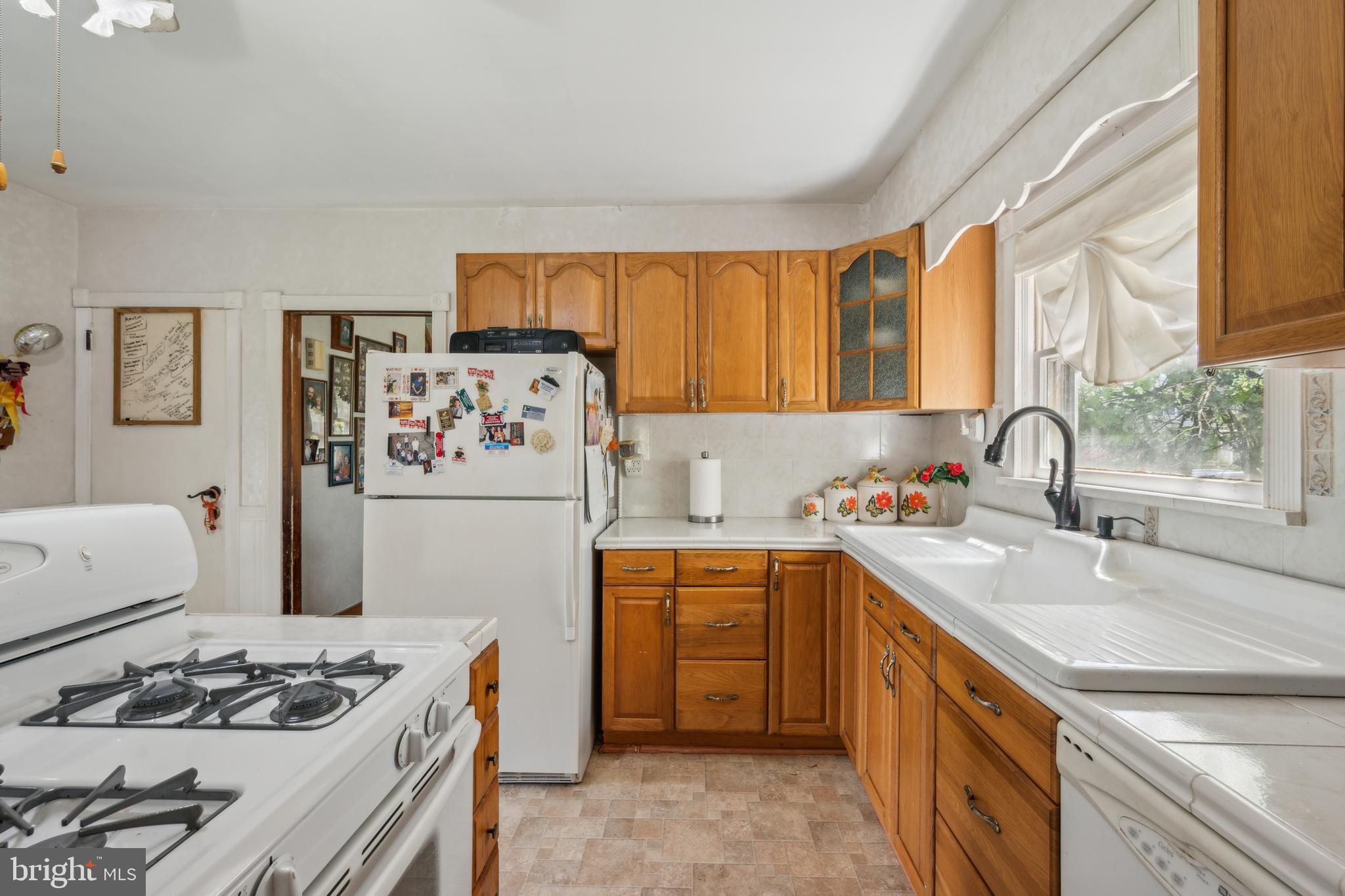 21 Devlin Avenue Burlington, NJ 08016 - Photo 10 of 20 a kitchen with stainless steel appliances a stove a sink and a refrigerator