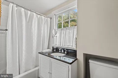 a view of a house with a large window and wooden floor