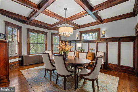 a living room with furniture and large windows