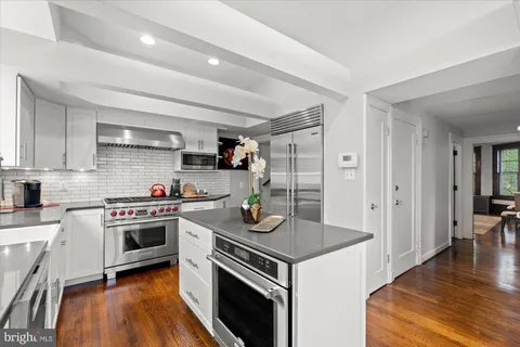 a bathroom with a tub and shower