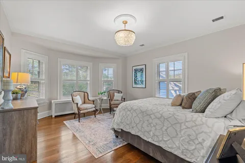 a view of a patio with table and chairs and potted plants
