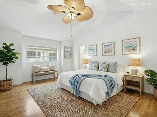 a bedroom with a large bed and a couch