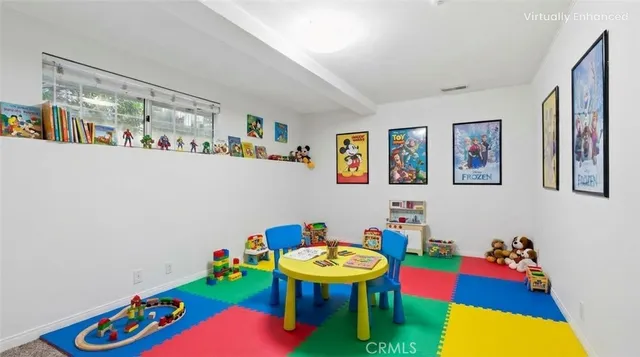 a living room with baby toys and furniture