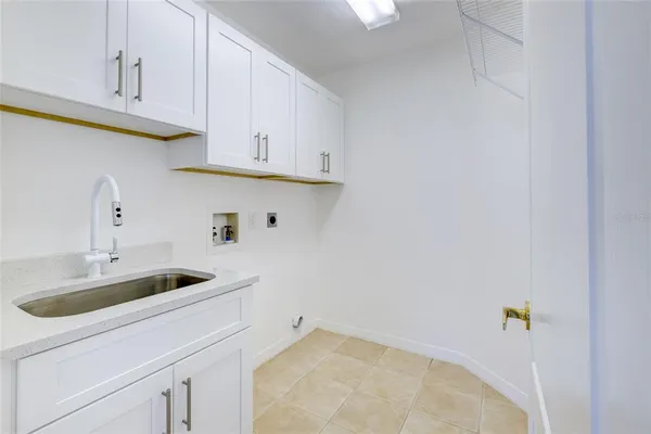 a kitchen with a sink and cabinets
