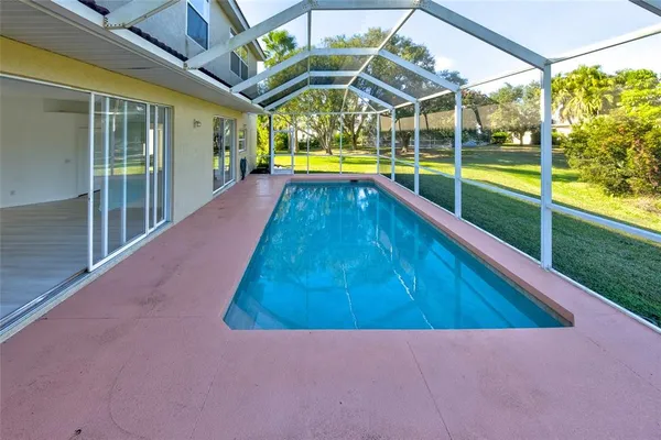 a view of swimming pool with a patio