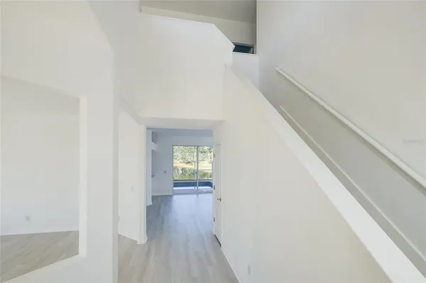 a view of an entryway with wooden floor