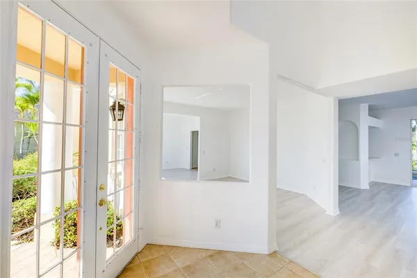 a view of an entryway with wooden floor and door