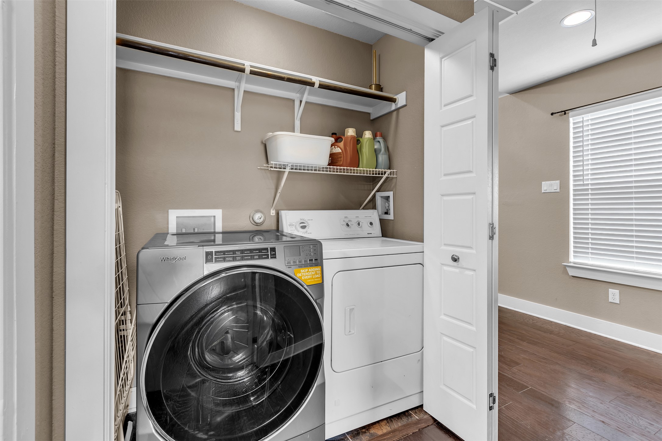 12212 Tawny Farms Road, Unit 142 Austin, TX 78748 - Photo 11 of 21 Functional utility space with washer, dryer, and convenient overhead shelving.