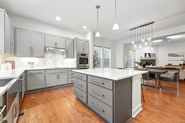 a kitchen with kitchen island granite countertop a sink and counter space