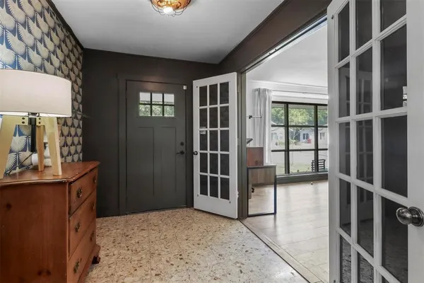 a view of a hallway with a window
