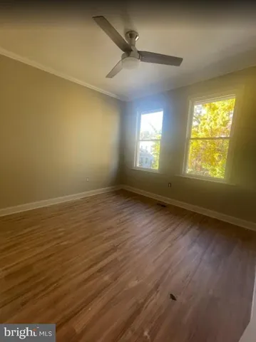 a bathroom with a granite countertop shower a sink and a mirror