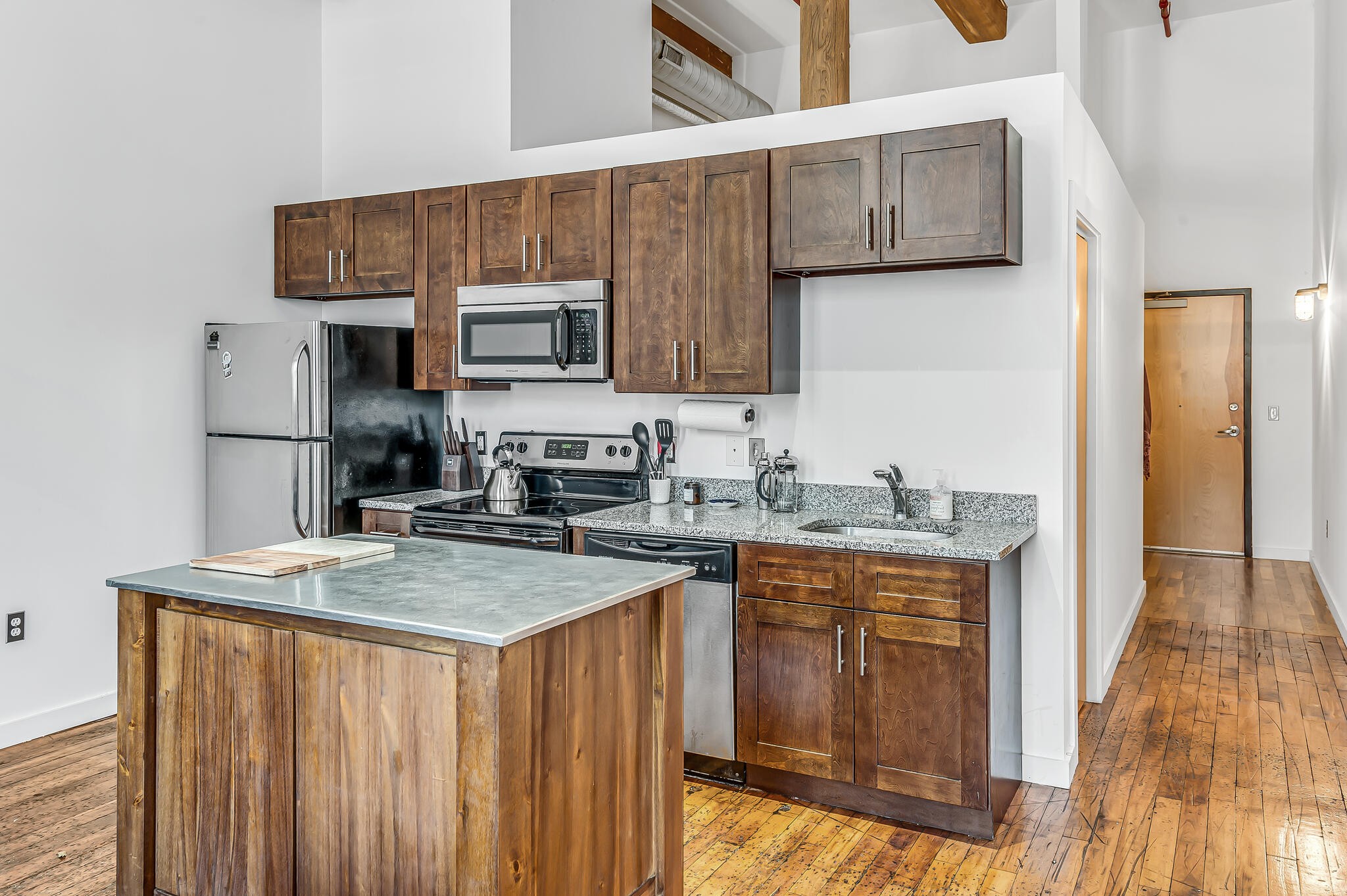 1350 Rosa L Parks Boulevard, Unit 338 Nashville, TN 37208 - Photo 11 of 28 a kitchen with stainless steel appliances granite countertop a sink stove and refrigerator