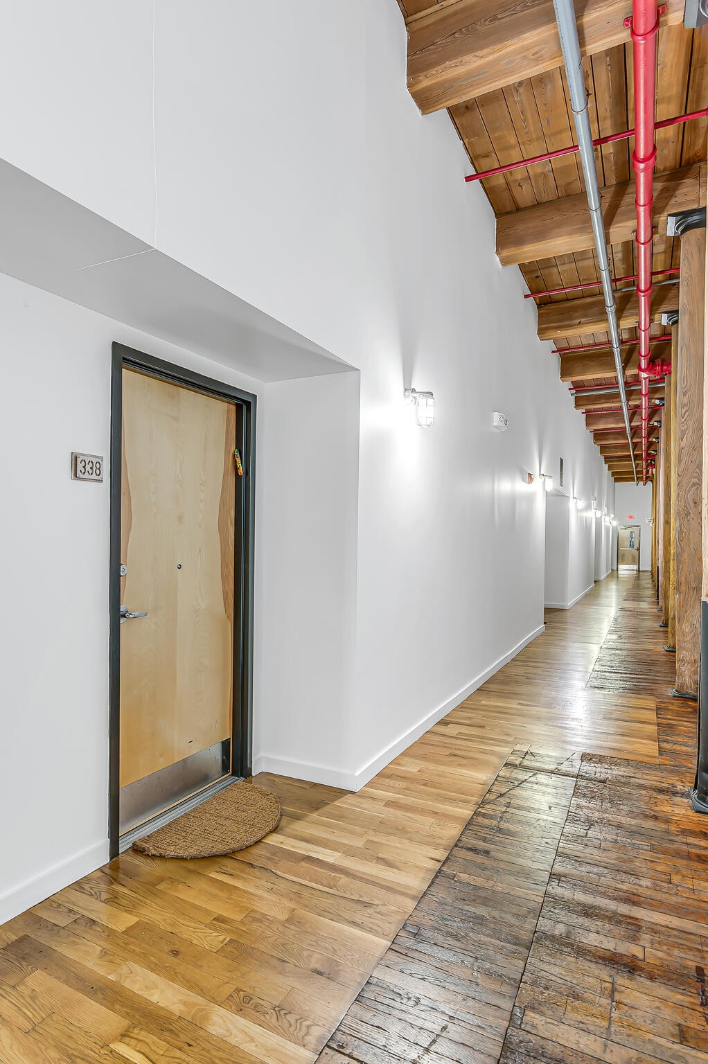 1350 Rosa L Parks Boulevard, Unit 338 Nashville, TN 37208 - Photo 3 of 28 a view of an empty room with wooden floor