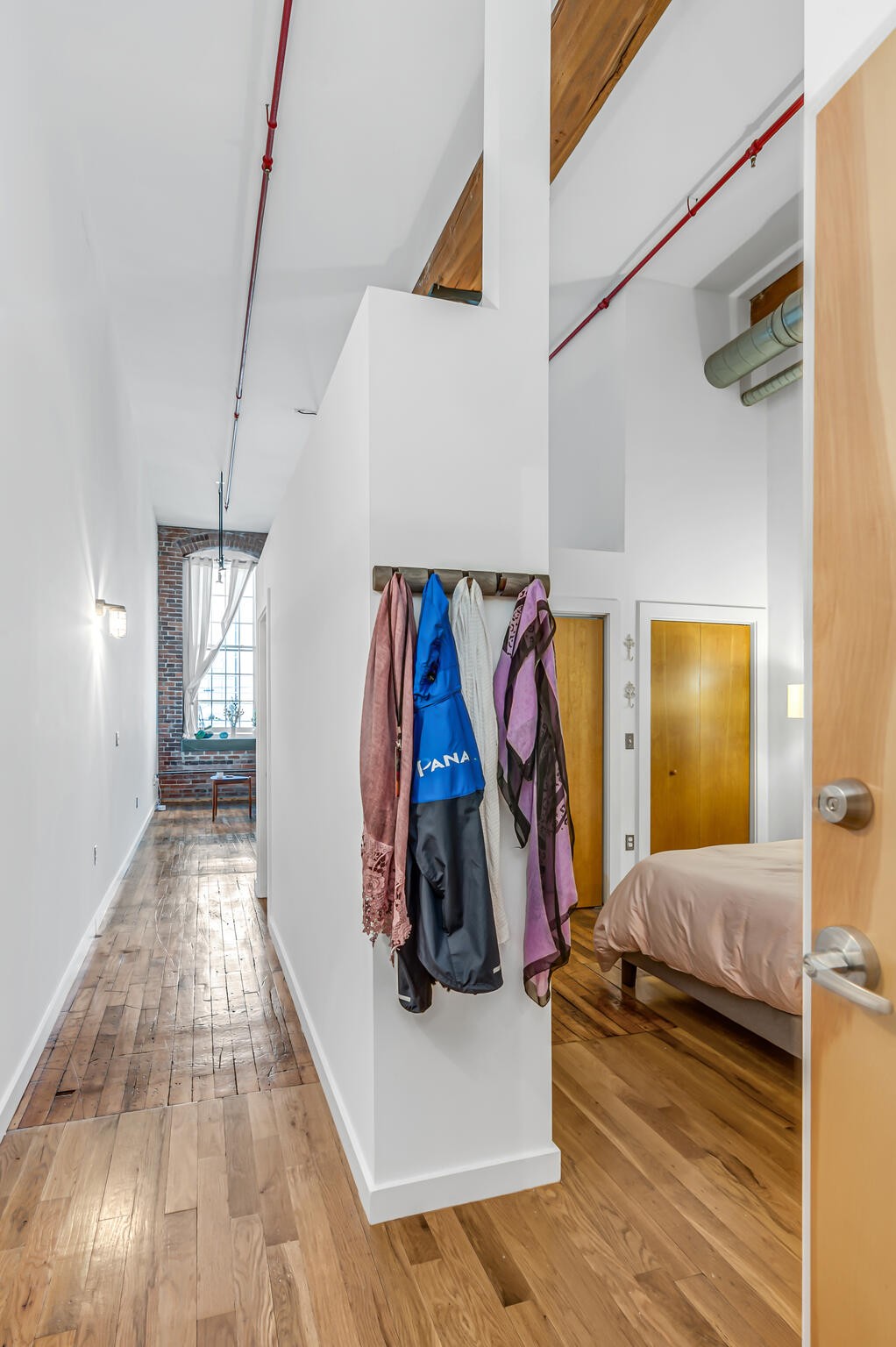 1350 Rosa L Parks Boulevard, Unit 338 Nashville, TN 37208 - Photo 4 of 28 a view of a bedroom with wooden floor and closet