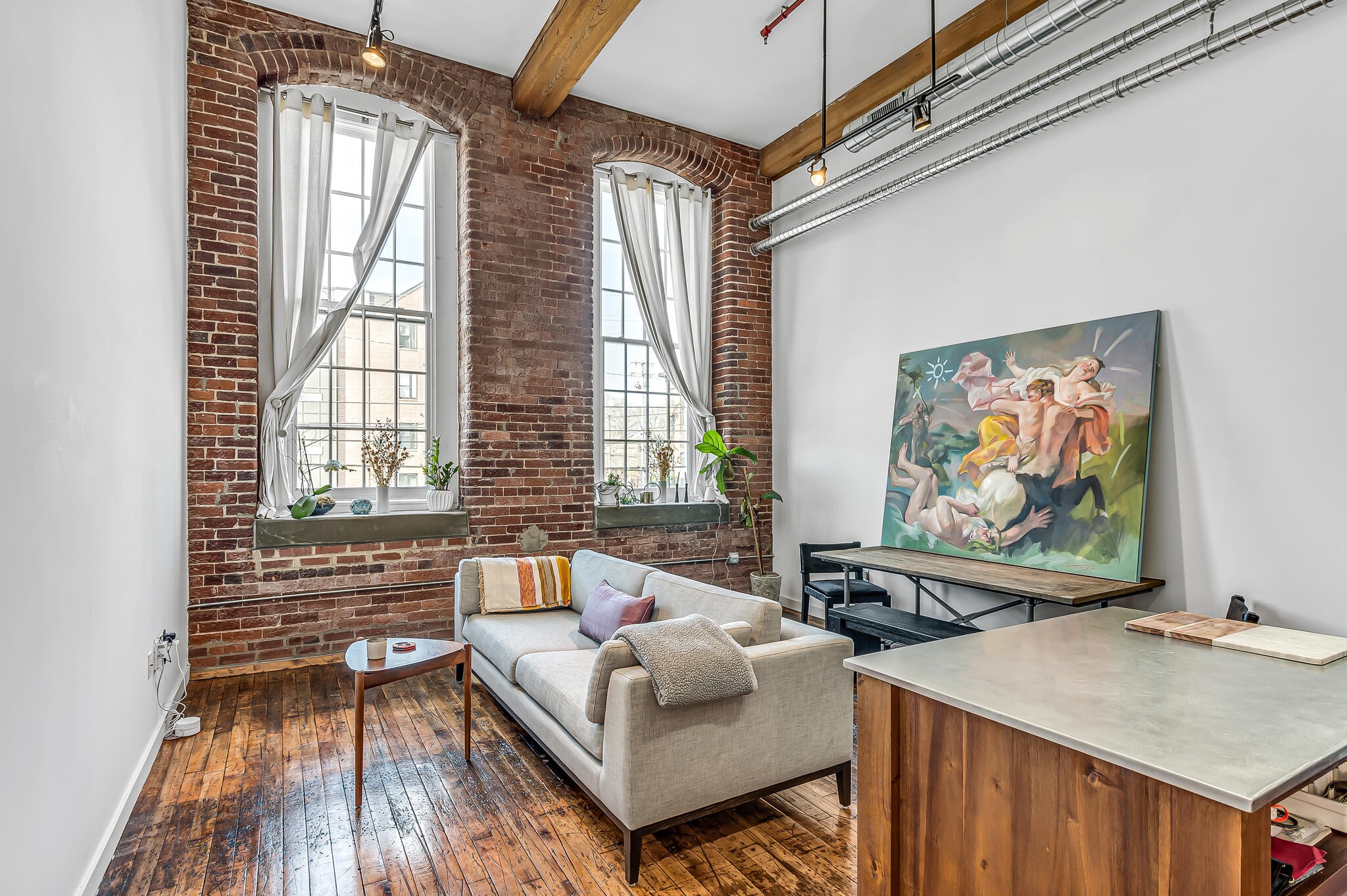 1350 Rosa L Parks Boulevard, Unit 338 Nashville, TN 37208 - Photo 6 of 28 a living room with furniture and a flat screen tv