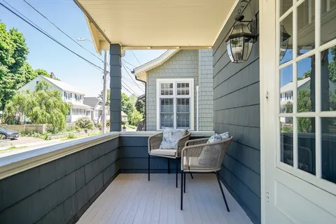 a balcony with furniture and window