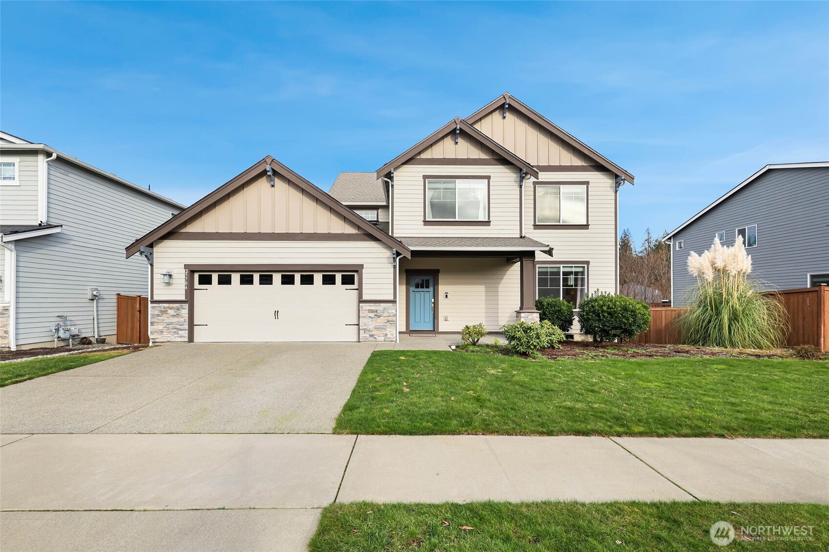 25704 207th Place Southeast Covington, WA 98042 - Photo 1 of 34 a front view of a house with a yard